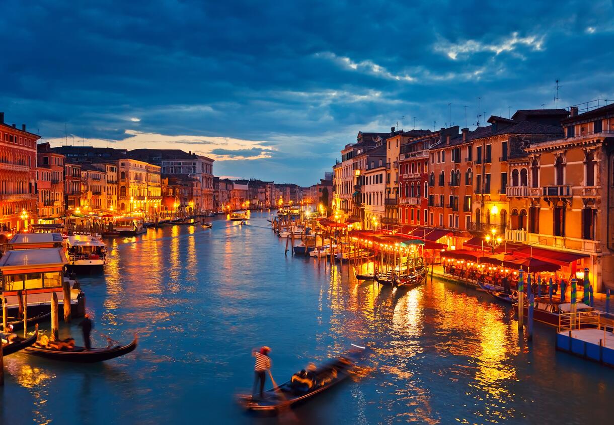 Venice Grand Canal with historic palazzos and gondolas at sunrise with soft golden light reflecting on calm water, Adriatic luxury cruise photography