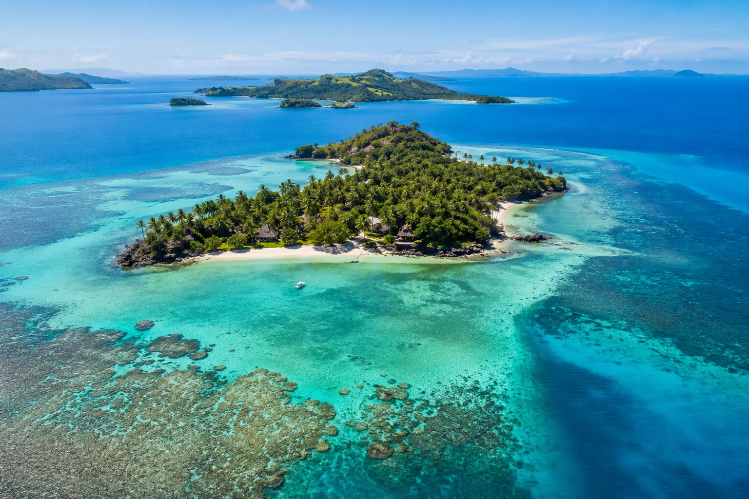 Marigot Bay harbor with luxury yachts anchored in calm turquoise water surrounded by green hillsides in Saint Lucia, coastal landscape travel photography