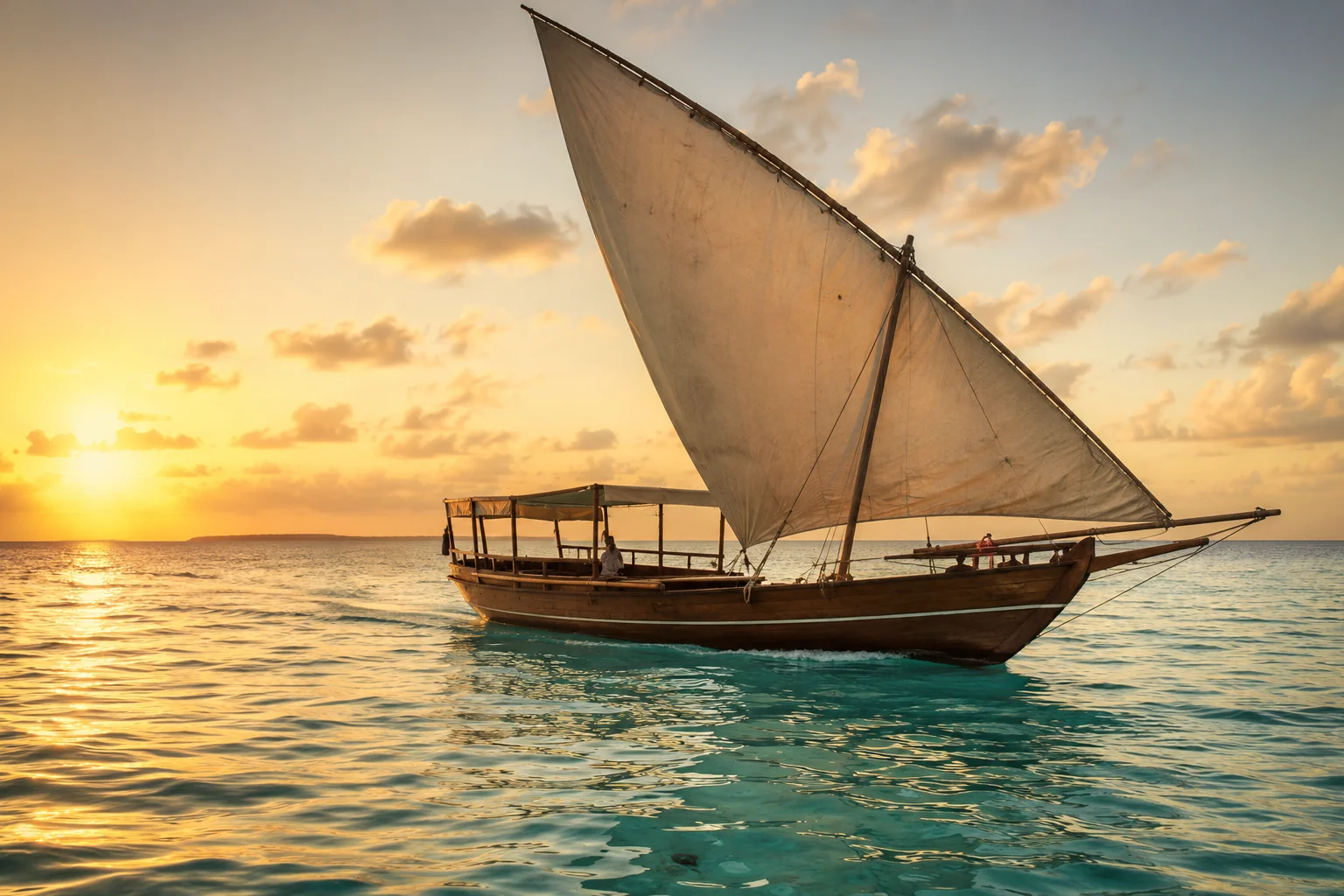 Zanzibar white sand beach with turquoise Indian Ocean water traditional dhow sailboat and clear blue sky, warm tropical light, luxury beach travel photography
