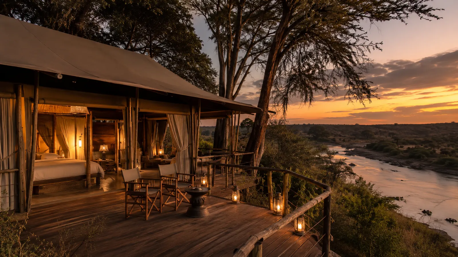 Luxury tented safari camp with private deck overlooking a Kenyan river at sunset with lanterns and canvas suites, refined safari lodge photography