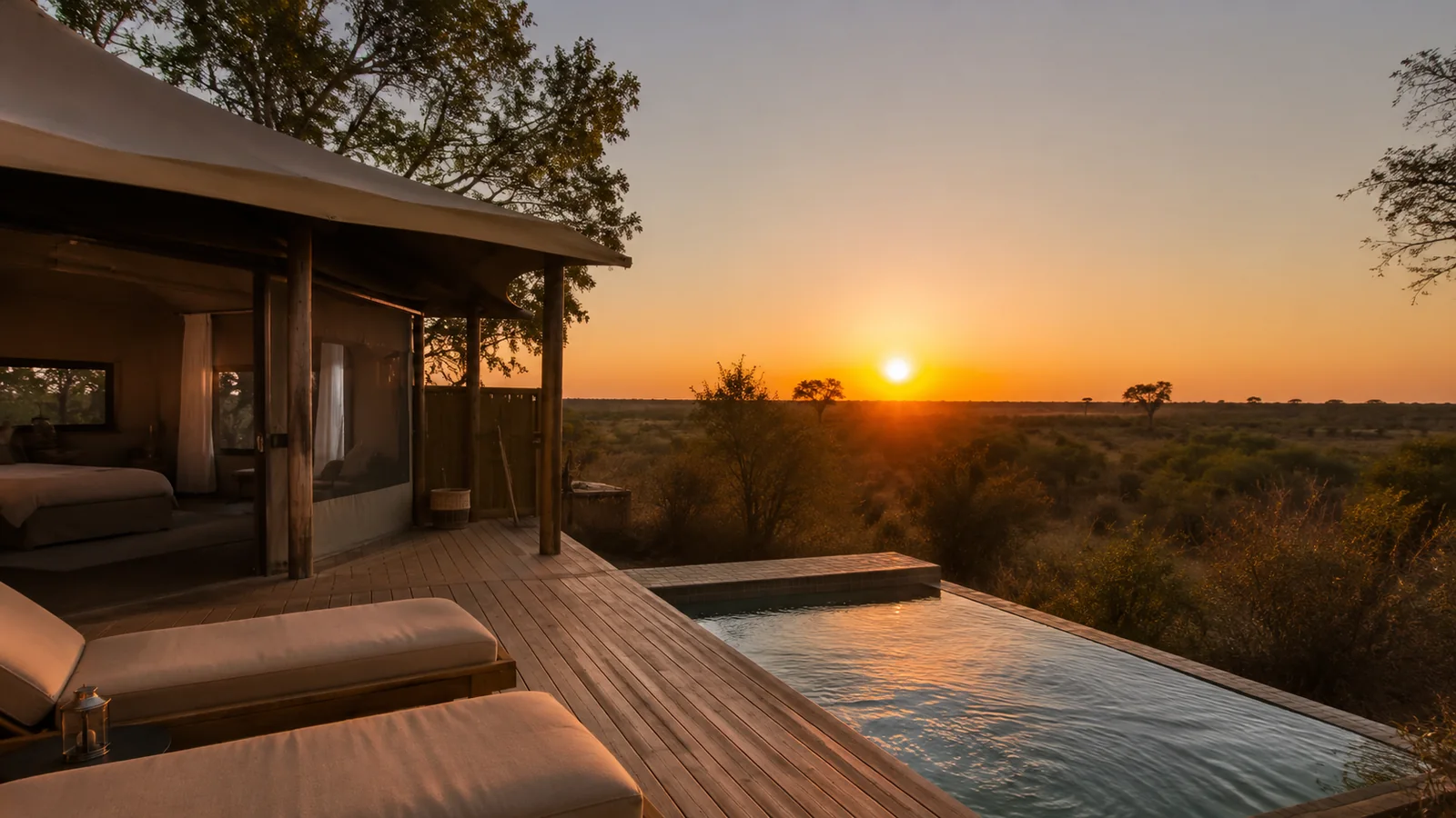 Luxury tented safari camp with private plunge pool overlooking the African bush at sunset, premium safari accommodation comparison photography